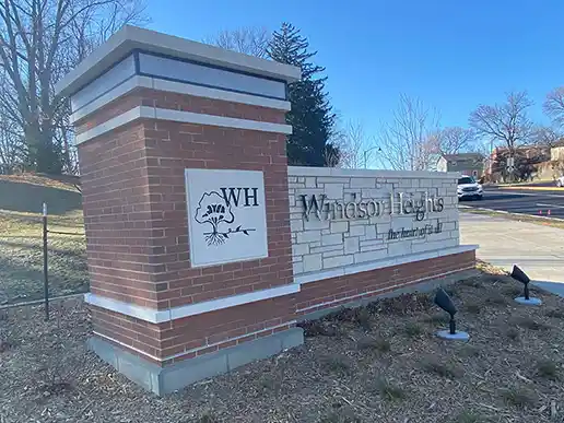 A brick sign welcomes drivers as they enter the city of Windsor Heights.